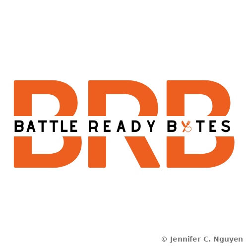 Battle Ready Bytes logo, the letters B R B in bold orange blocky type spanning the full width, overlaid in the center by the words Battle Ready Bytes in black bold sans-serif capital letters, with the Y in Bytes stylized as an orange knife and fork crossed together with a small heart where the utensils meet