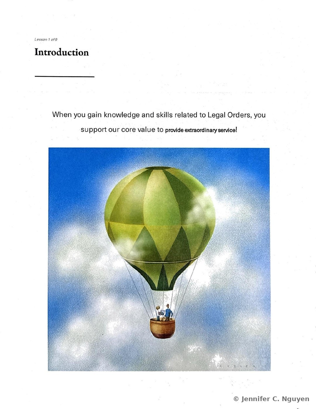 Introduction slide numbered Lesson 1 of 9 with an illustration of a green and yellow striped hot air balloon carrying two passengers above white clouds against a blue sky, accompanying text stating that gaining knowledge and skills related to Legal Orders supports the core value to provide extraordinary service